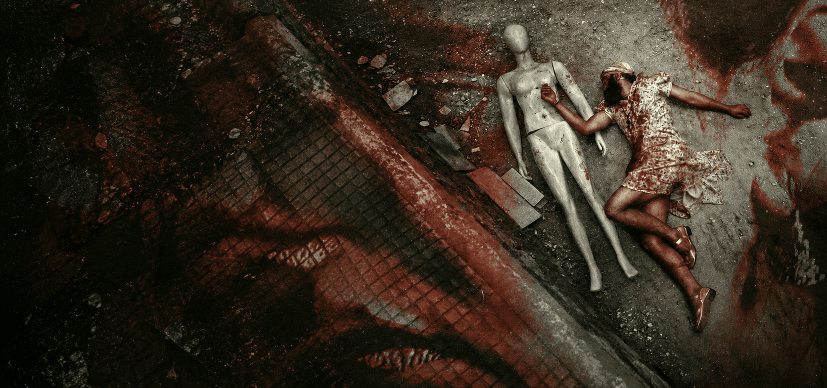 Overhead view of a mannequin lying beside a woman in a blood-stained dress on a gritty floor.